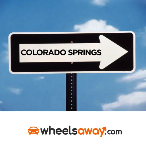 colorado springs road sign with wheelsaway logo 