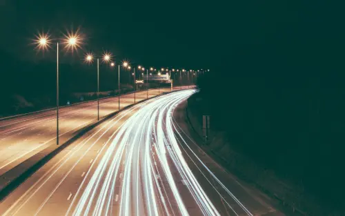 image of a busy road at night time